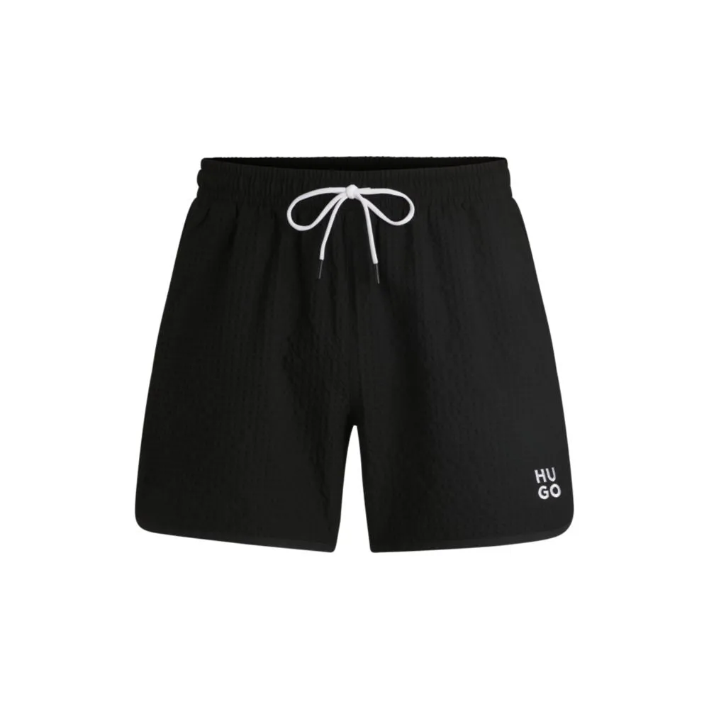 Waffle-structured swim shorts with embroidered stacked logo